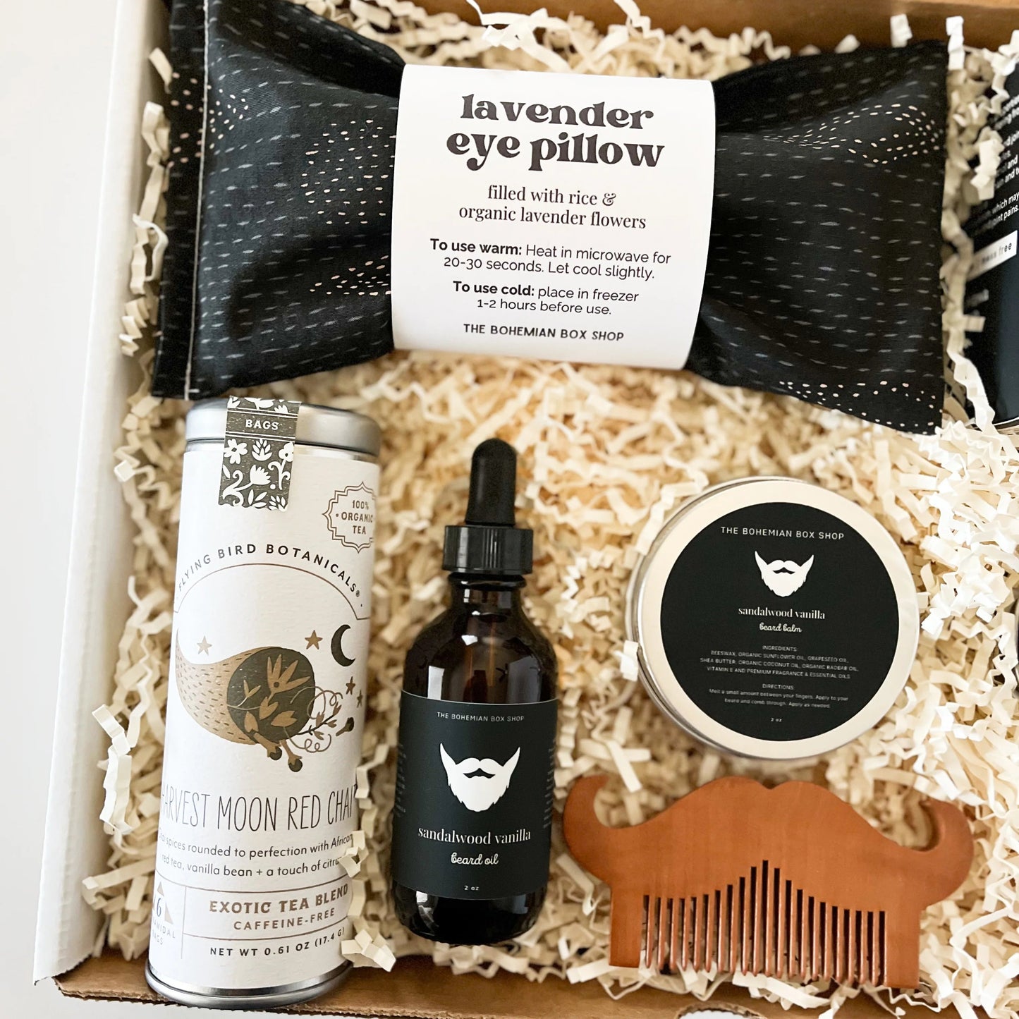 Black & White Men’s Curated Gift Box. Includes lavender eye pillow, bath bomb, harvest moon red chai tea, beard care kit, around the bonfire soy candle, and moon phases matchbox. 