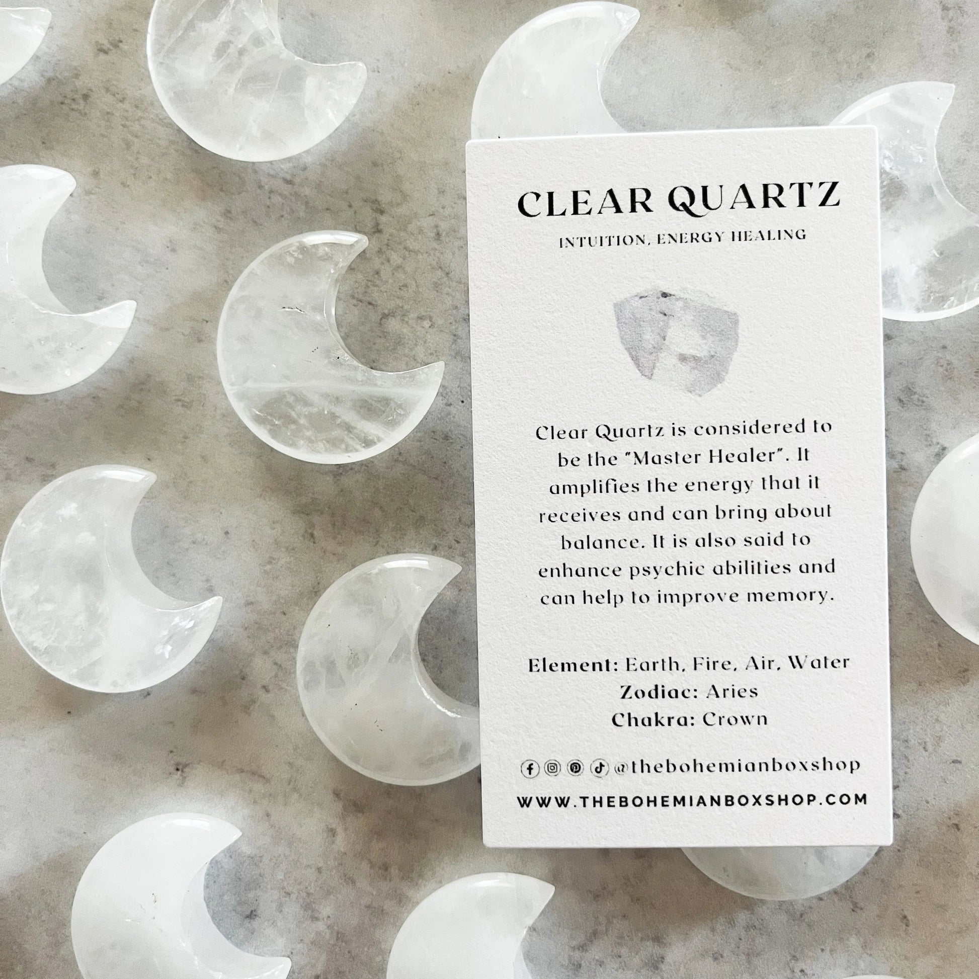 Clear quartz moon crystals with informational keepsake card.