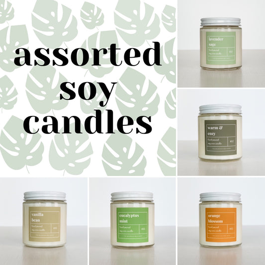 Assorted 4 ounce, Boho, soy candles, with clear jar, white lid and colorful label. ￼