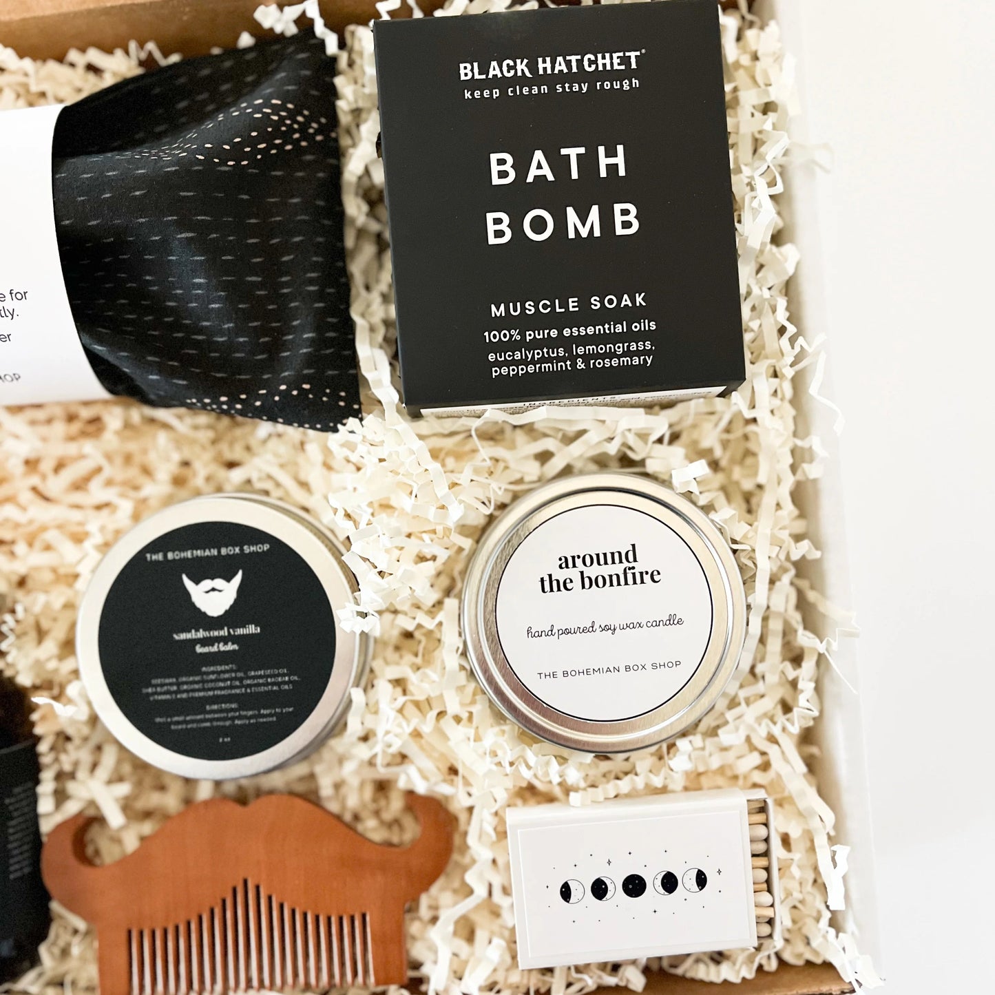 Black & White Men’s Curated Gift Box. Includes lavender eye pillow, bath bomb, harvest moon red chai tea, beard care kit, around the bonfire soy candle, and moon phases matchbox. 