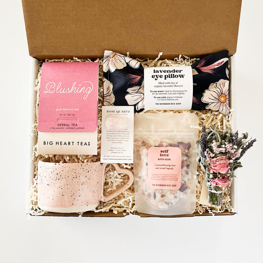 Self-love care package for her. Contains blushing tea, heart shaped mug, rose quartz crystal, lavender eye pillow, self-love bath soak with affirmation and mini sage bundle. ￼