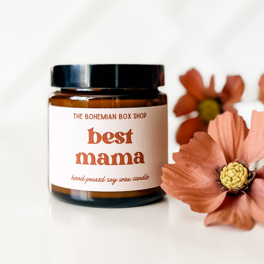 Boho Style Best Mama 4oz Soy candle poured in an amber jar with black lid.