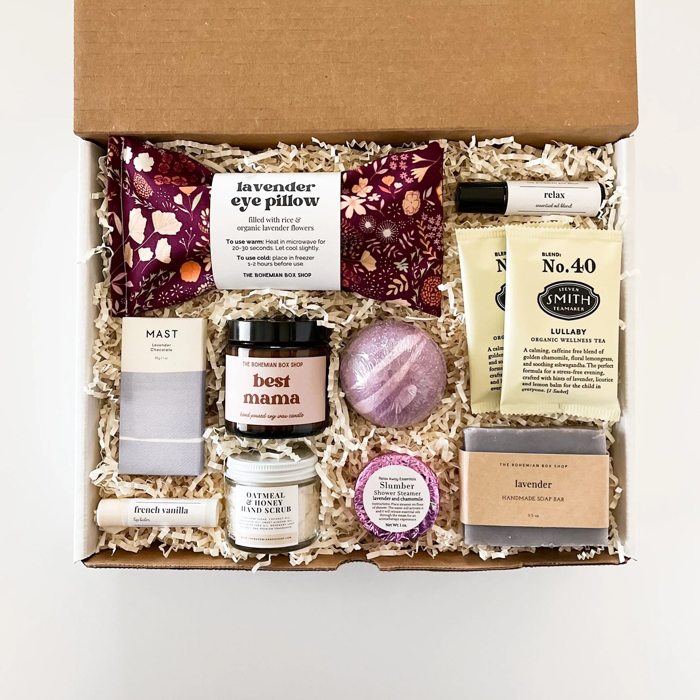 Care package for any Mom. Contains lavender eye pillow, chocolate bar, French vanilla lip balm, best mama soy candle, hand scrub, bath bomb, shower steamer, tea packets, relax roller bottle, and lavender soap. 