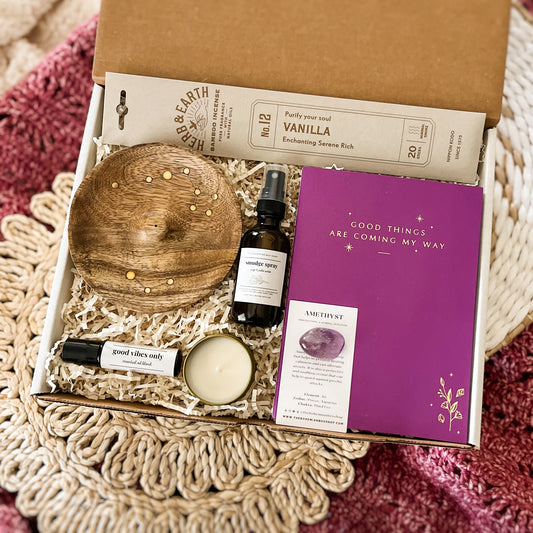 Spiritual Gift Set Box - Good Things Are Coming gift set. Includes vanilla incense, wooden celestial incense holder, good vibes only roller bottle, soy candle, smudge spray, amethyst crystal and journal.￼
