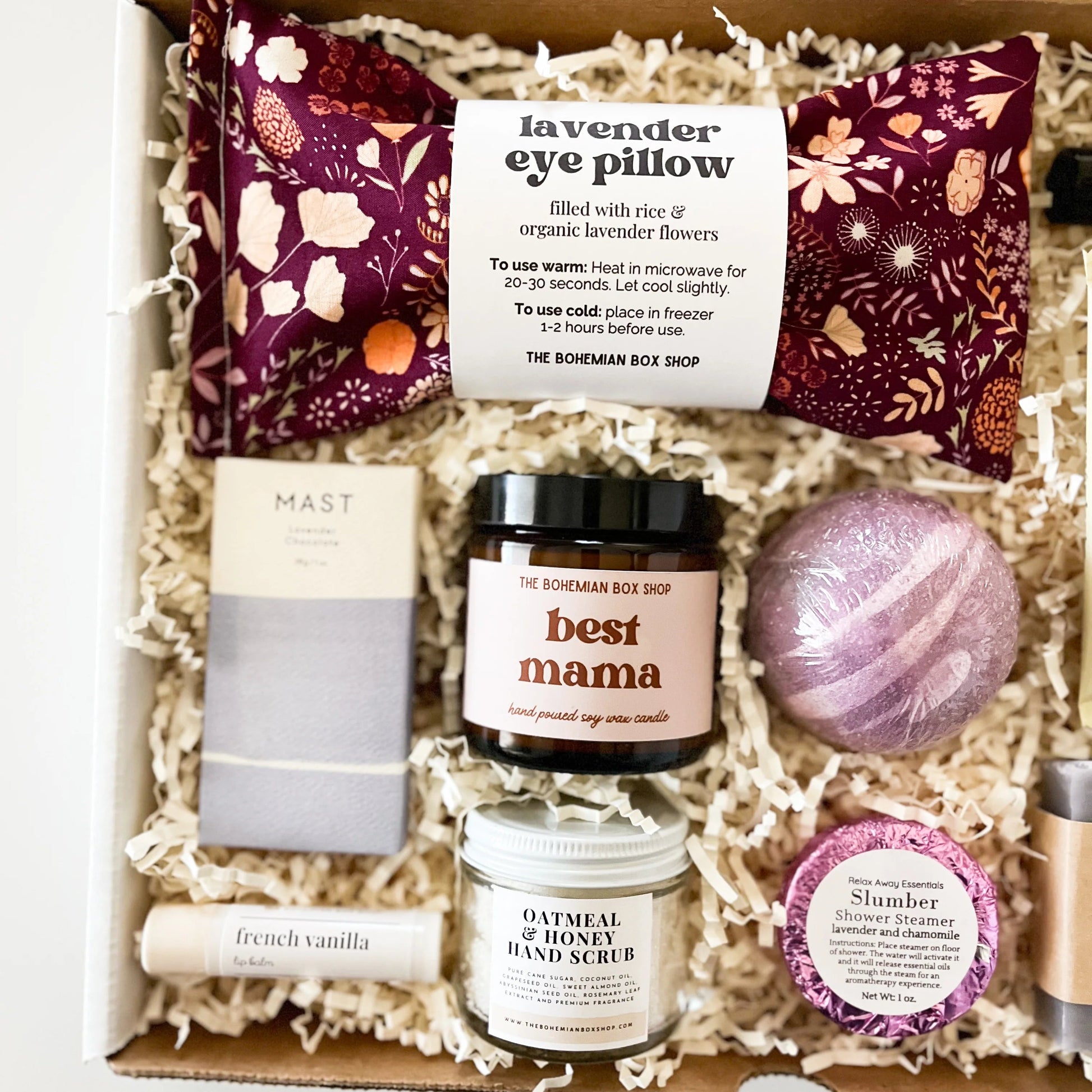 Care package for any Mom. Contains lavender eye pillow, chocolate bar, French vanilla lip balm, best mama soy candle, hand scrub, bath bomb, shower steamer, tea packets, relax roller bottle, and lavender soap. 