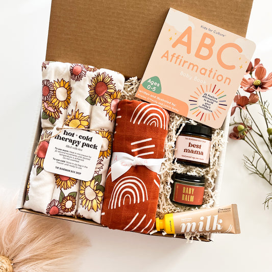 Boho Gender Neutral New Mom and Baby Gift Set. Includes hot and cold therapy pack, boho Muslin swaddle blanket, ABC affirmation book, best mama soy candle, baby balm and milk and honey handcream. ￼