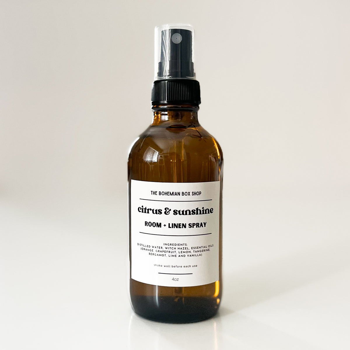 citrus and sunshine Brown glass spray bottle with a label on a white background