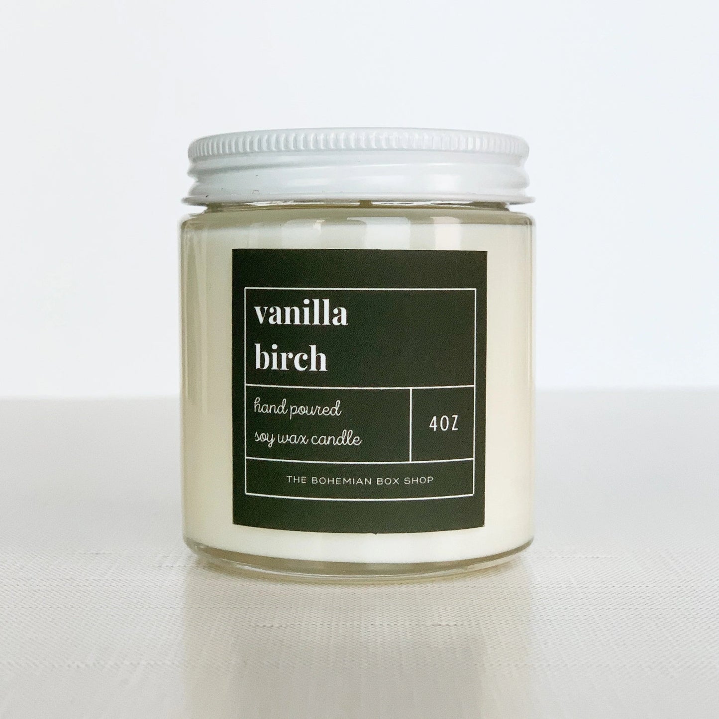 4 ounce vanilla birch, soy candle in a clear jar with white lid.￼