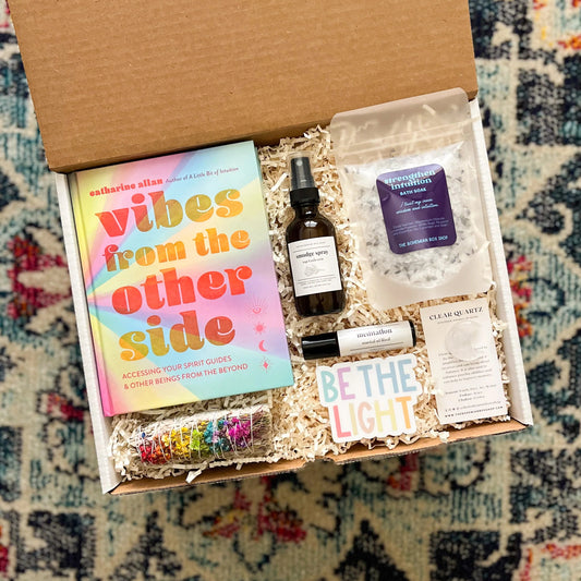 Be the light gift set. Includes vibes from the other side book, sage bundle, smudge spray, meditation roller bottle, be the light sticker, intuition bath soak, and clear quartz moon crystal. ￼