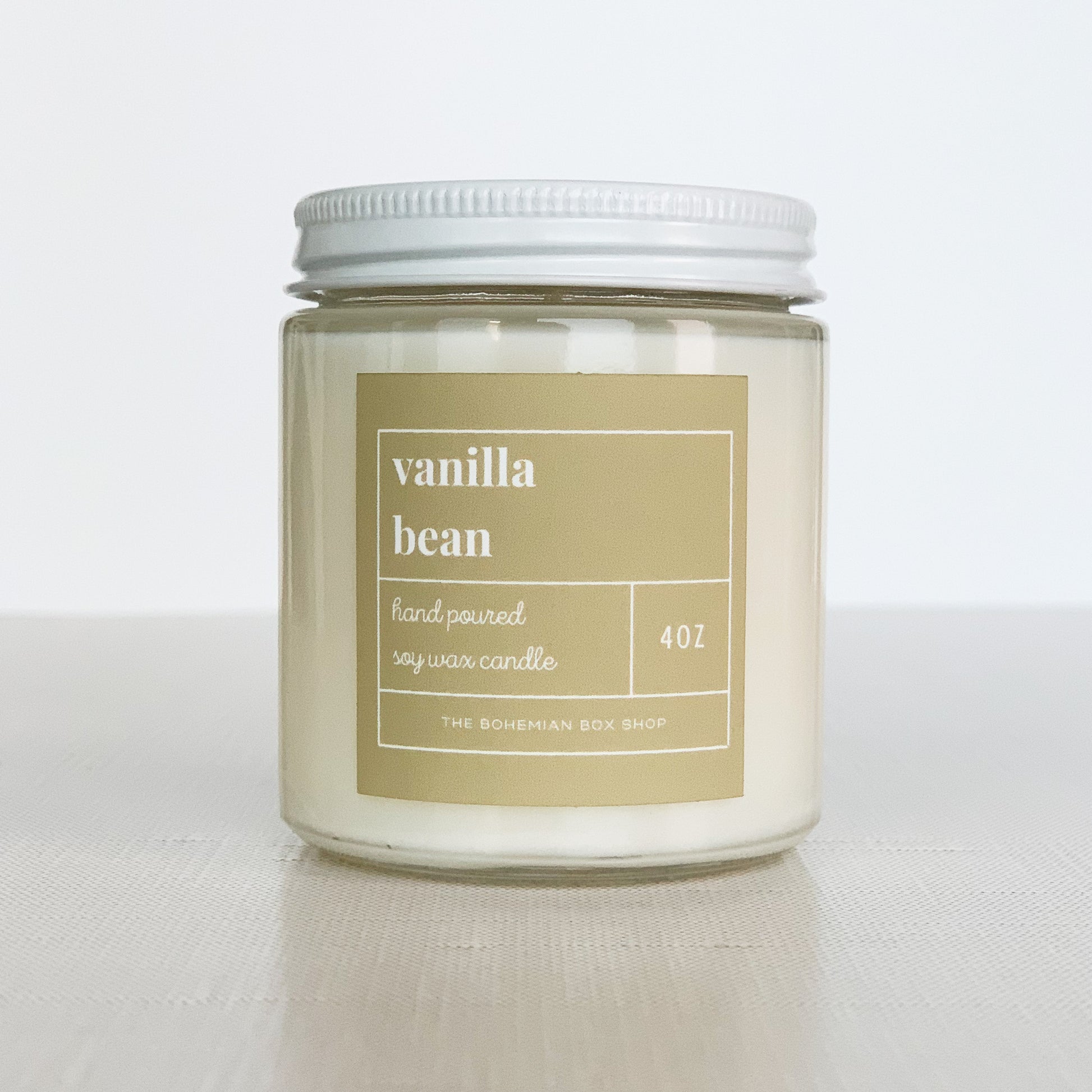 4oz vanilla bean soy candle in a clear jar and white lid