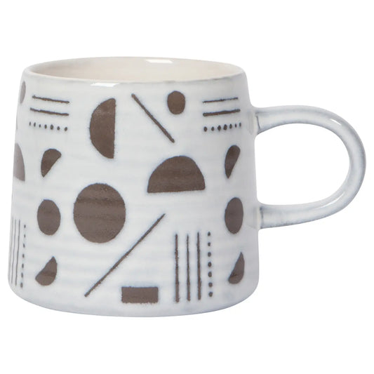 A ceramic mug with a geometric boho pattern in brown and white colors on a white background, featuring a sturdy handle.