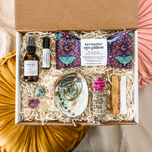 Crown Chakra Healing Gift Set. Includes smudge spray, crystals, crown chakra roller bottle, smudge kit, and Luna moth lavender eye pillow. ￼