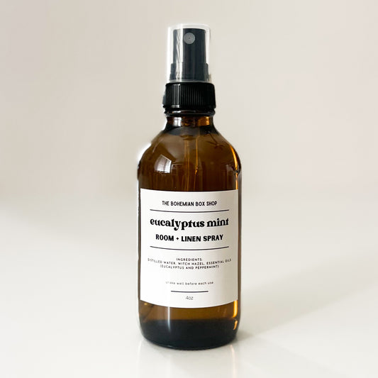 eucalyptus mint room and linen glass spray bottle with a label on a white background