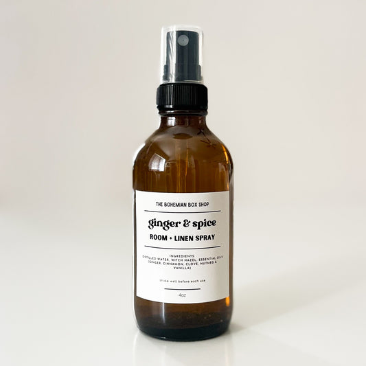 ginger and spice amber glass spray bottle with a label on a light background