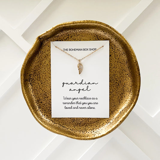 Guardian angel wing charm necklace ￼made by The Bohemian Box Shop