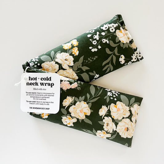 green Floral patterned hot and cold neck wrap with a label on a white background