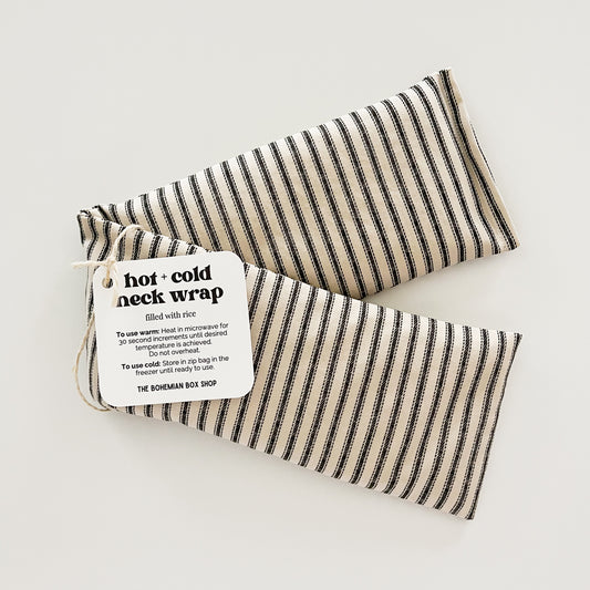a striped neck wrap, with a label that reads 'HOT-COLD NECK WRAP' and the brand 'BOHEMIAN BOX'.