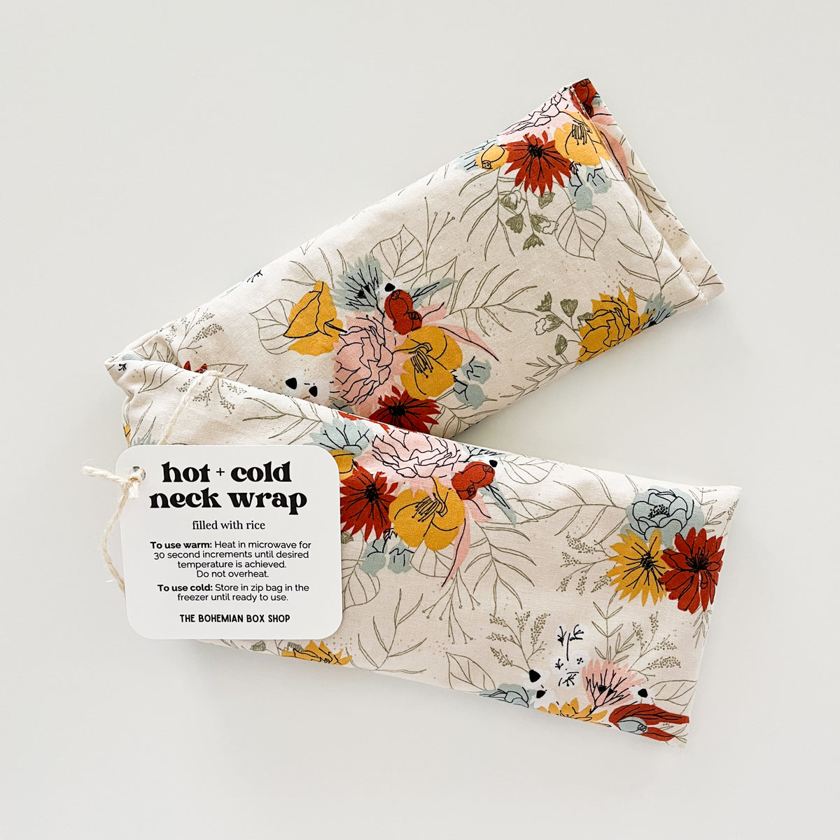 ivory floral hot and cold neck wrap made by The Bohemian Box Shop on a white background