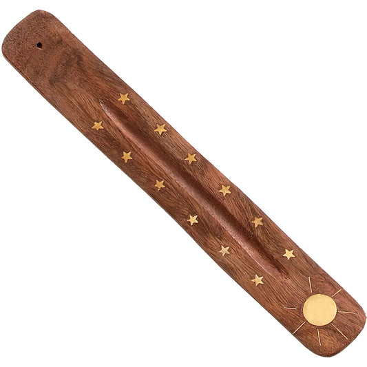 A wooden incense holder with a brass sun and stars design, featuring a banana shape and a central golden sun with radiating stars.
