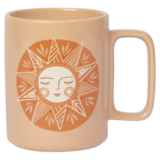 A light orange ceramic mug with a geometric sun design and a handle on the side.