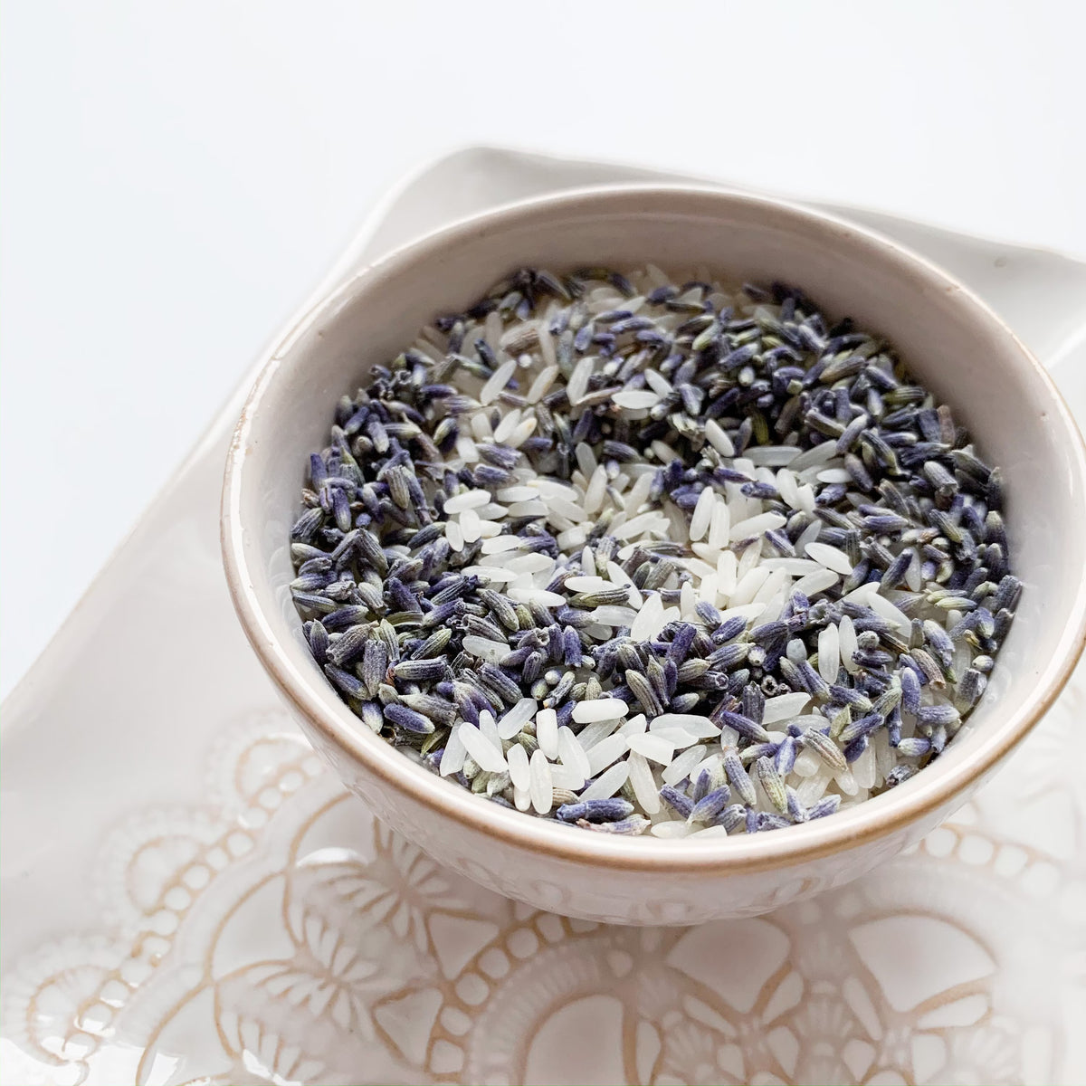 Bowl of lavender and rice on a decorative plate
