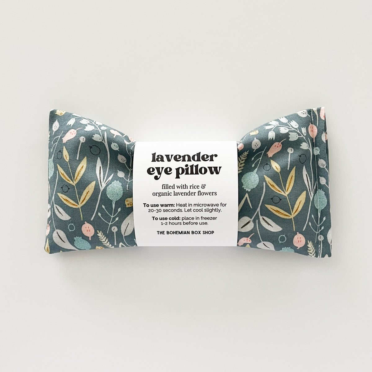 light green eye pillow with floral pattern