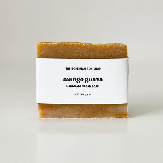 A bar of handmade vegan soap with 'The Bohemian Box Shop Mango Guava' label on a white background.