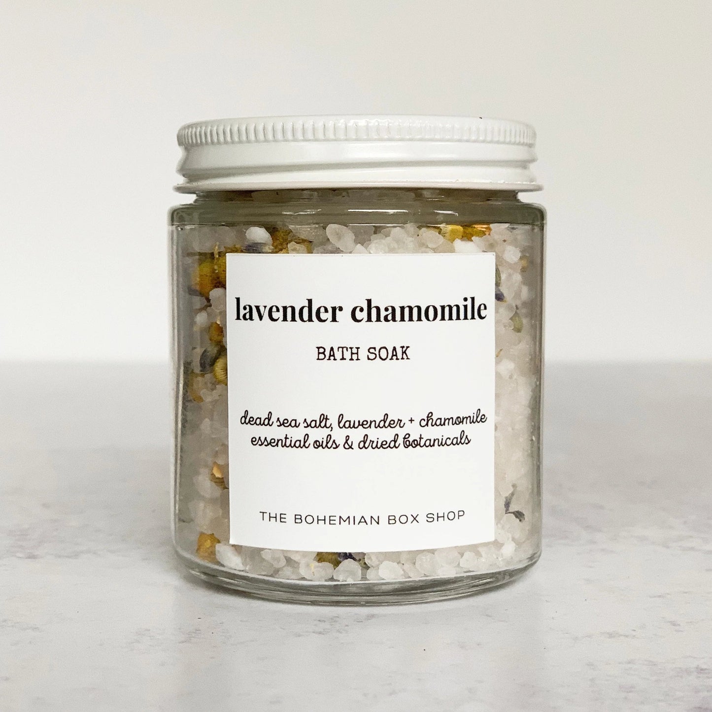 lavender chamomile bath soak in a clear jar with white lid