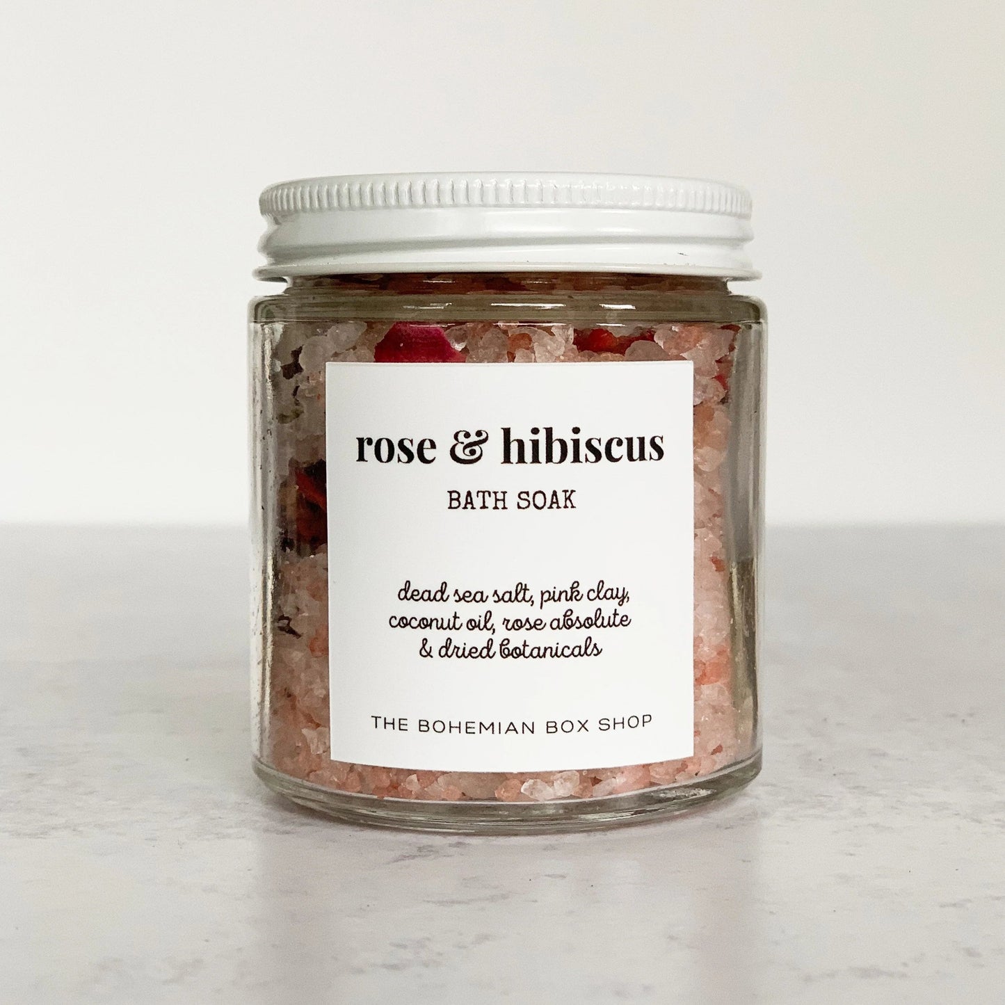 Rose and Hibiscus Bath Soak in a clear jar with white lid
