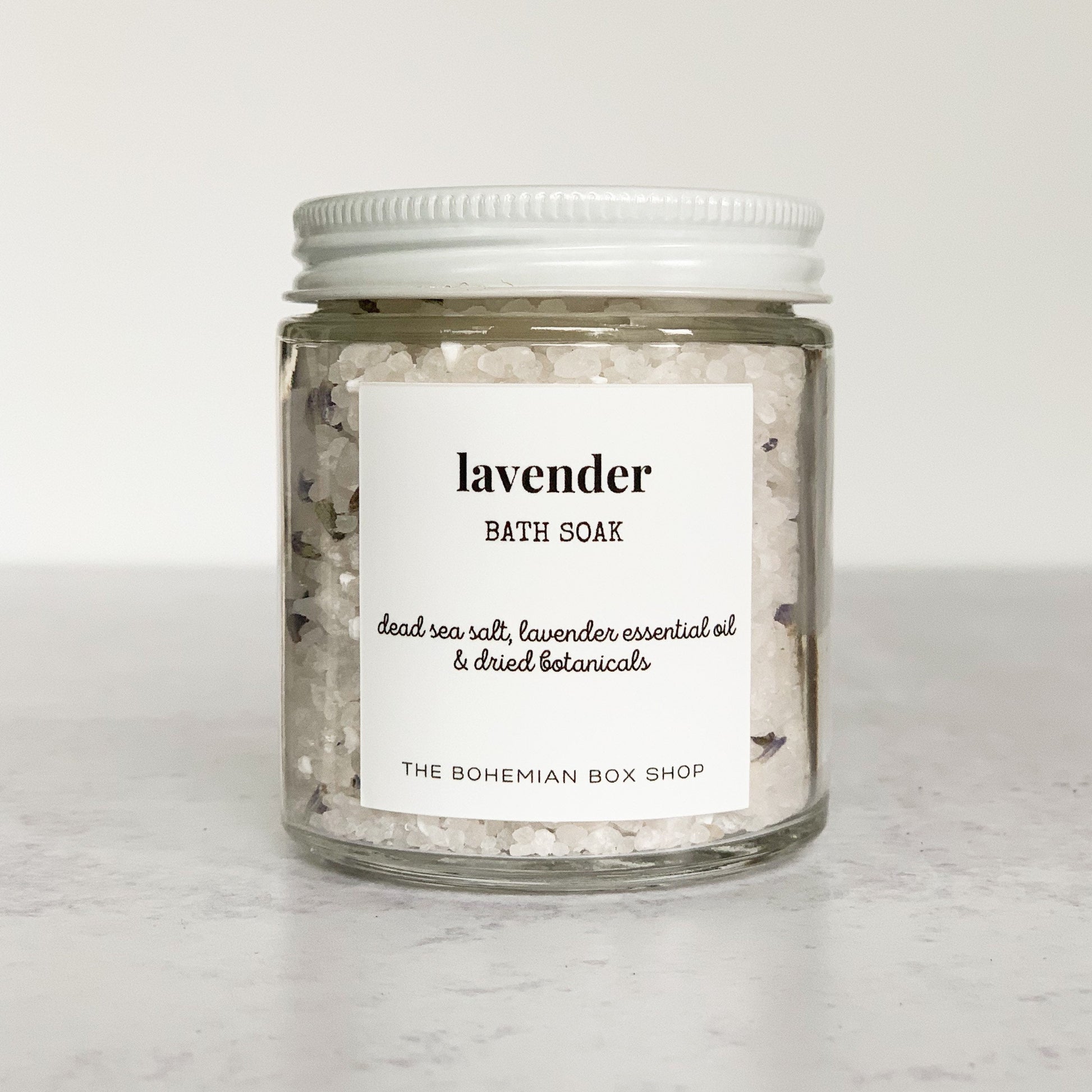lavender bath salts in a clear jar with white lid