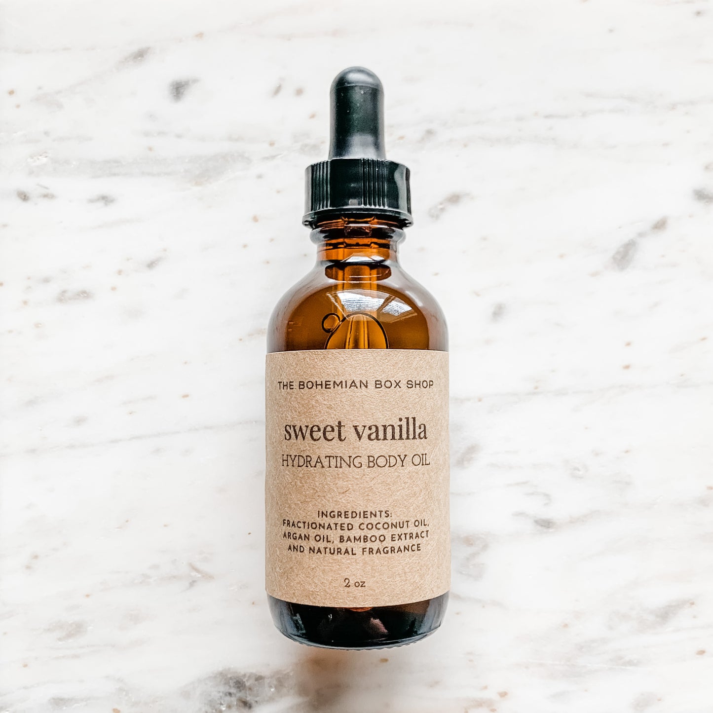 Sweet Vanilla Hydrating Body Oil in 2oz amber glass bottle with black dropper 