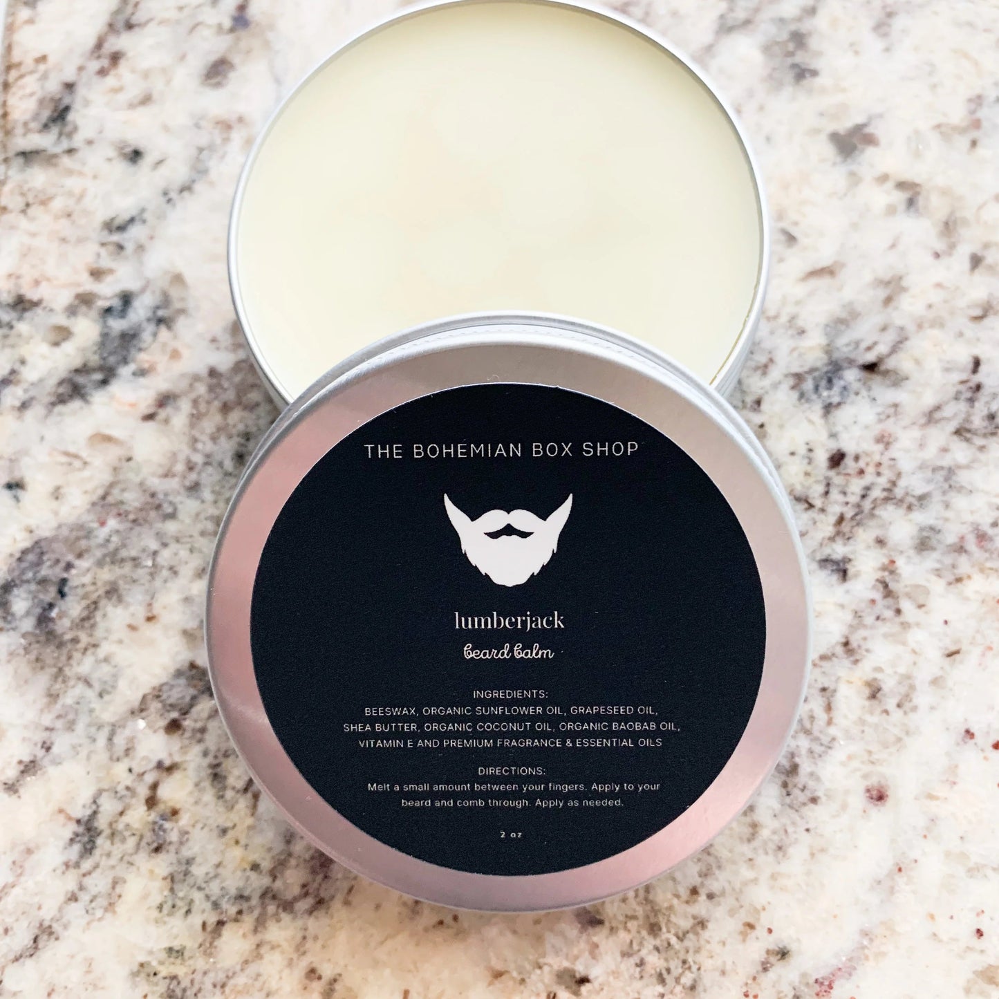 lumberjack beard balm in a 2oz tin with black label 