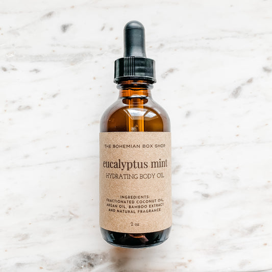 2oz Eucalyptus Mint Hydrating Body in an amber colored bottle and black dropper