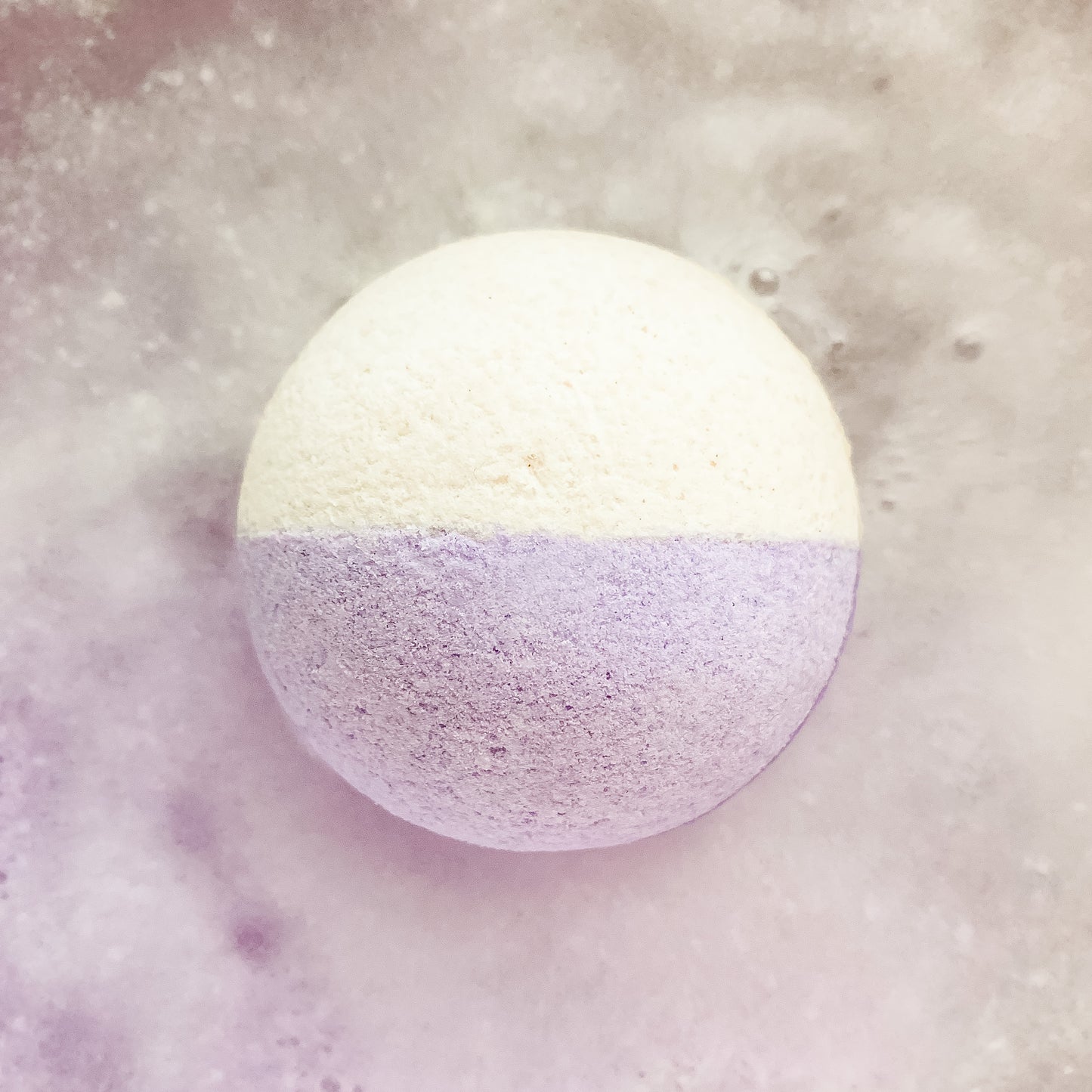 love spell bath bomb light pink and purple 