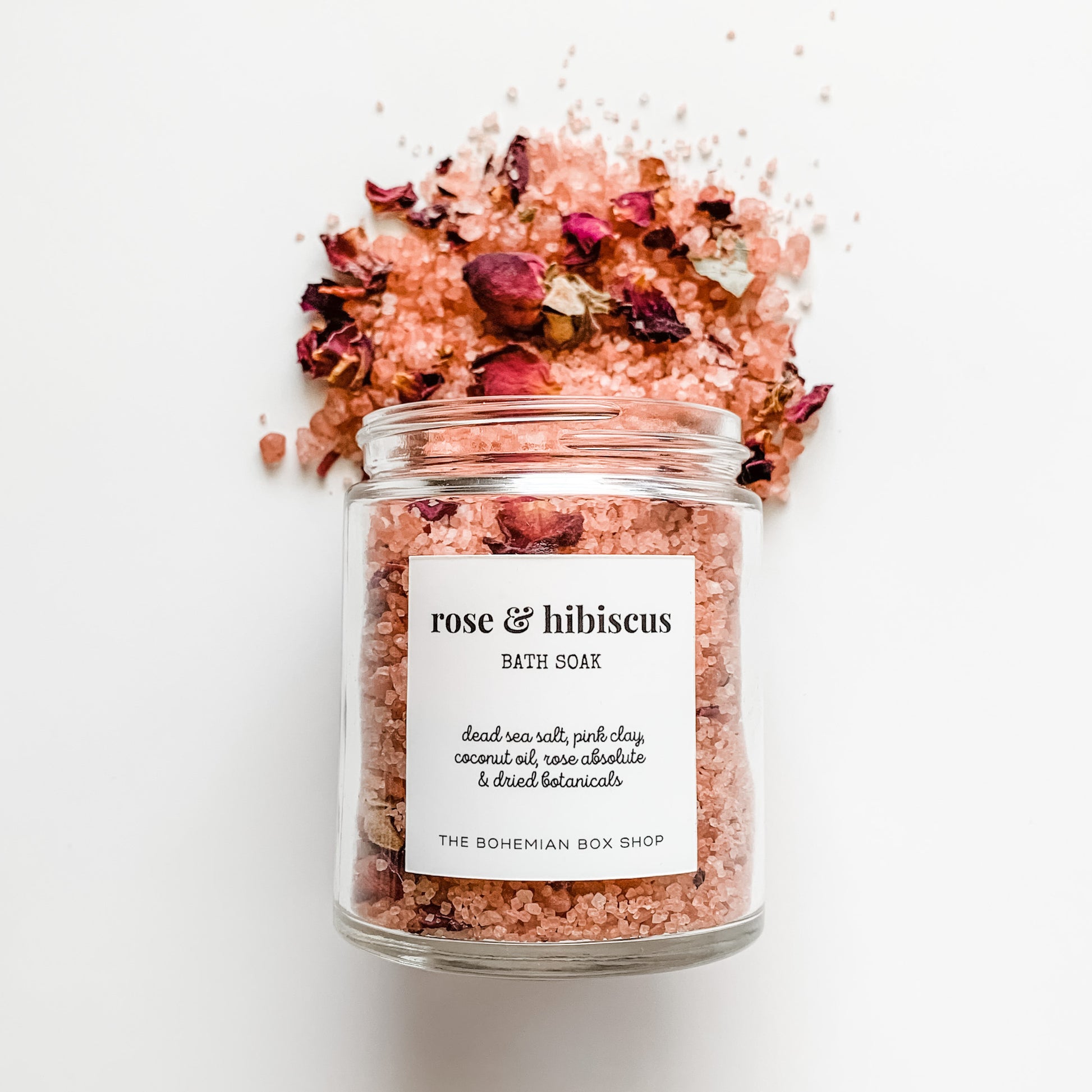 Rose and Hibiscus Bath Soak in a clear glass jar with white label 