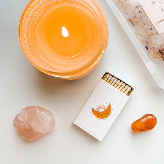 Moon and Sun - Boho Style Match Box with a lit candle and rose quartz crystal and carnelian crystal