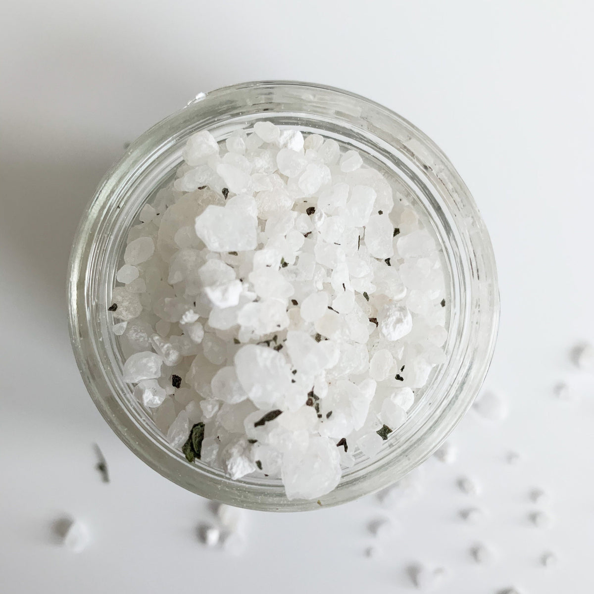 Peppermint foot soak in a jar on a white background