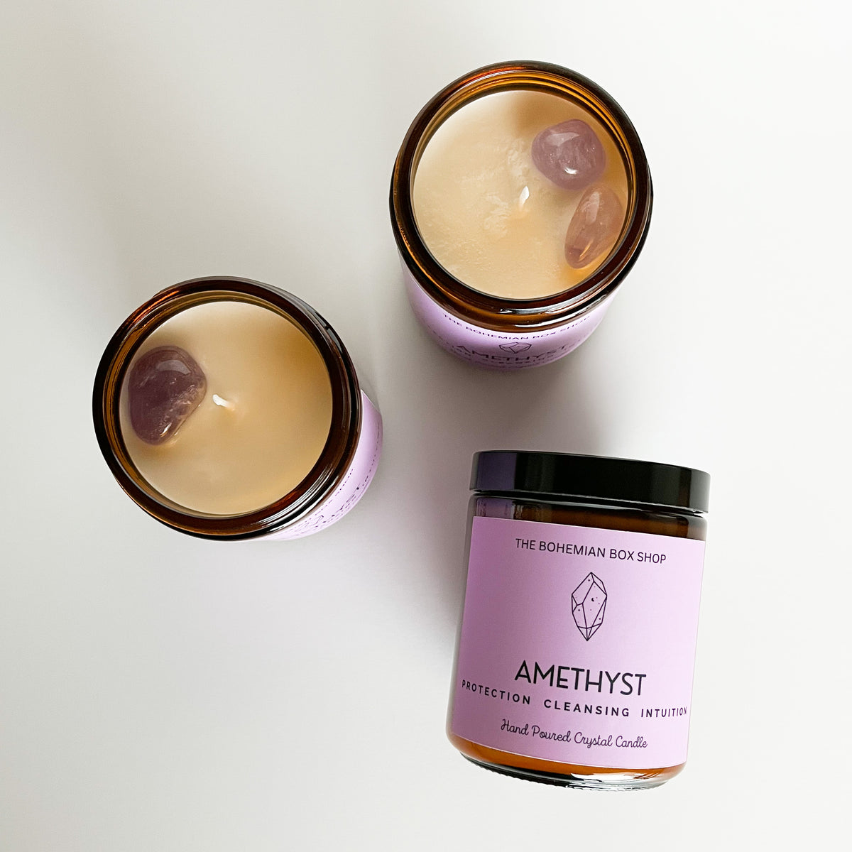 three amethyst soy candles on a white background