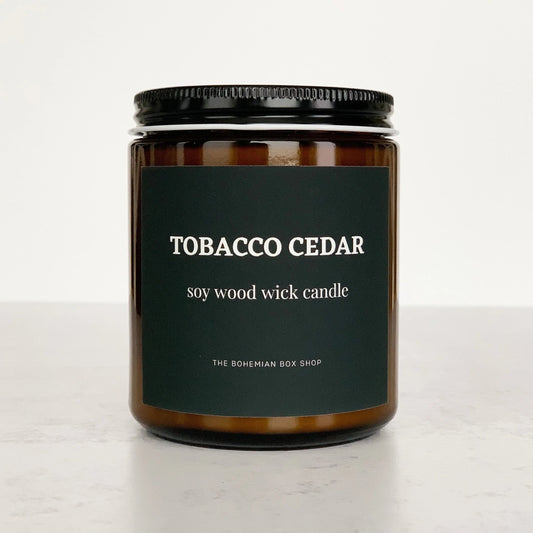 Tobacco Cedar 8oz Amber Jar Soy Candle with black lid and wood wick 
